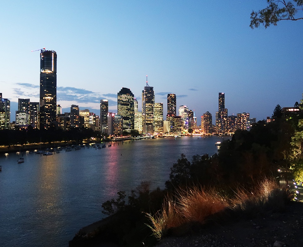 Night falls across Brisbane river and city